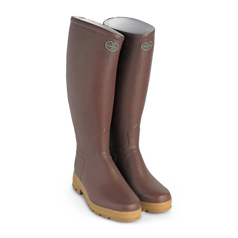 Bottes femmes Le Chameau Saint-Hubert avec doublure en cuir, offrant élégance et imperméabilité pour les activités en plein air, confectionnées artisanalement avec caoutchouc Chamolux et renforts en fibres d’aramide.