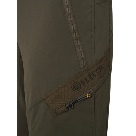 Pantalon de chasse pour femme Beretta Boondock, conçu pour les environnements difficiles avec tissu élastique et polyamide haute ténacité, offrant résistance et mobilité optimale dans les zones de ronces et végétations denses.