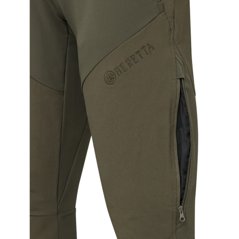 Pantalon de chasse pour femme Beretta 4 Way Stretch conçu pour l'outdoor avec élasticité et résistance, équipé d'inserts anti-abrasion, ventilation zippée, soutien lombaire élevé et coupe slim pour un confort durable dans les activités en automne et hiver.
