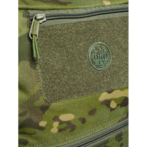 Sac à dos Beretta Tactical Flank Multicam de 17 L avec système M.O.L.L.E et compartiment pour ordinateur, idéal pour activités tactiques et missions sur le terrain, conception robuste en nylon hydrofuge avec poches YKK et intégration Multicam pour camouflage optimal.