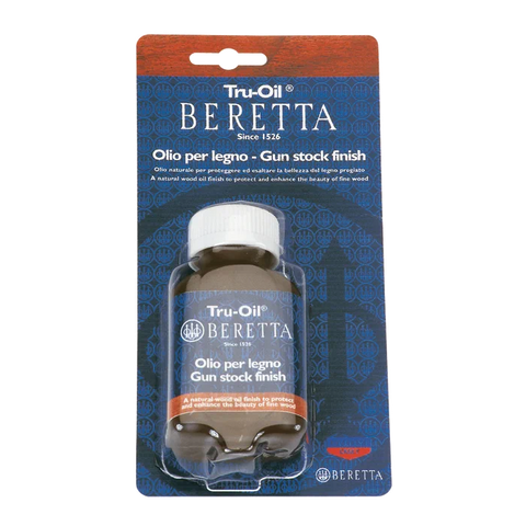 Image showing the Beretta TRU-OIL gun stock maintenance oil, emphasizing its quick drying, non-yellowing properties, and natural oil composition ideal for maintaining and preserving the beauty and durability of wooden gun stocks.