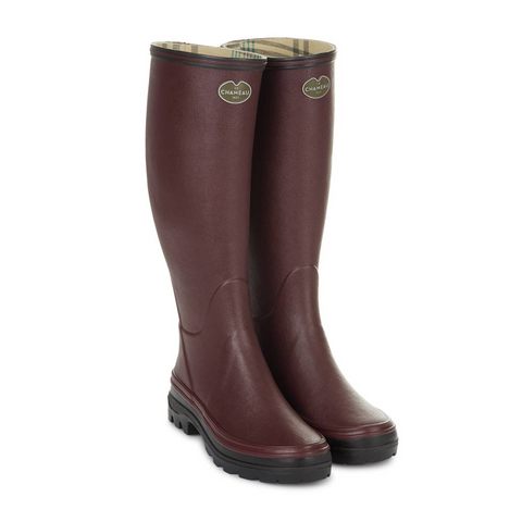 Bottes en caoutchouc naturel pour la marche à la campagne avec doublure en jersey poly-coton ultra-résistante et semelle bi-densité antichoc Le Chameau, offrant confort et adhérence tout terrain, imperméables et fabriquées artisanalement.
