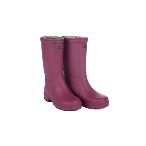 Bottes pour enfants Le Chameau confectionnées à la main avec caoutchouc Chamolux et doublées jersey, parfaites pour aventures en plein air, offrant confort, imperméabilité et style.