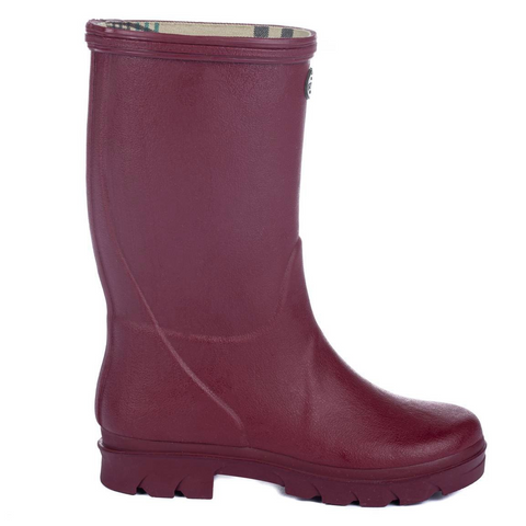 Bottes pour enfants Le Chameau confectionnées à la main avec caoutchouc Chamolux et doublées jersey, parfaites pour aventures en plein air, offrant confort, imperméabilité et style.
