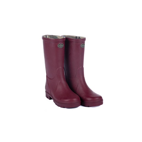 Bottes pour enfants Le Chameau confectionnées à la main avec caoutchouc Chamolux et doublées jersey, parfaites pour aventures en plein air, offrant confort, imperméabilité et style.