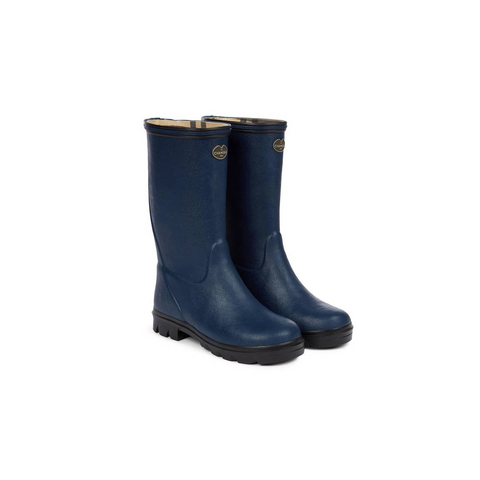 Bottes pour enfants Le Chameau confectionnées à la main avec caoutchouc Chamolux et doublées jersey, parfaites pour aventures en plein air, offrant confort, imperméabilité et style.