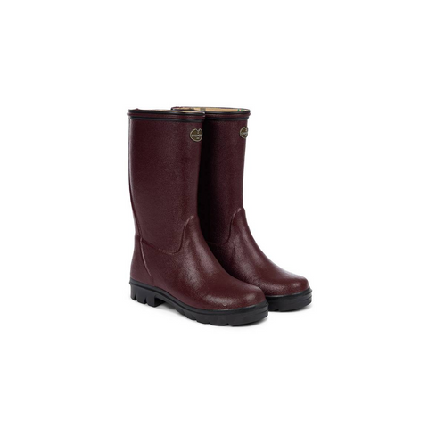 Bottes pour enfants Le Chameau confectionnées à la main avec caoutchouc Chamolux et doublées jersey, parfaites pour aventures en plein air, offrant confort, imperméabilité et style.