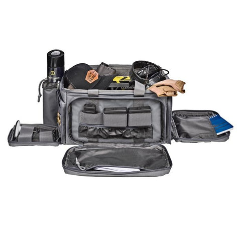 Sac de tir Bergara en polyester gris avec multiples compartiments amovibles, poches zippées et sangles MOLLE, idéal pour armes de poing, chargeurs, et accessoires de tir sportif. Dimensions 43 x 28 x 26 cm, volume 20 litres, avec porte-cartes transparent et double poignée pour transport sécurisé