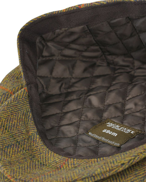 Casquette plate en tweed gris de qualité supérieure pour les activités de chasse et de plein air, fabriquée par Jack Pyke, offrant une protection solaire et un style intemporel. Idéale pour les chasseurs et randonneurs recherchant un accessoire élégant et fonctionnel.