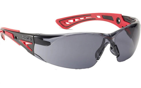 Lunettes de protection BOLLE SAFETY Rush+ avec verres fumés noir, offrant une protection anti-rayures et anti-buée, idéales pour une protection visuelle contre UV et impacts, avec un design moderne et élégant.