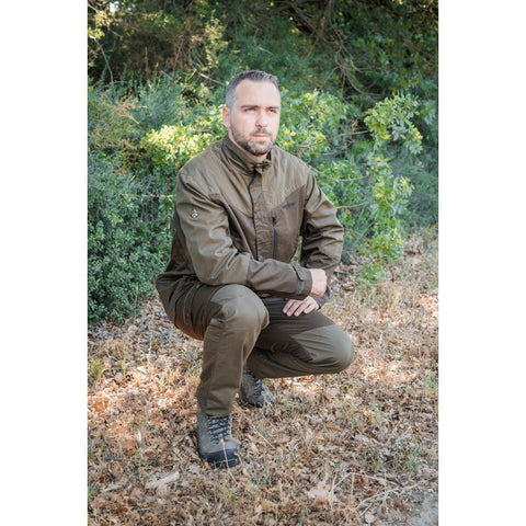 "Veste en canevas marron Treeland, modèle T630, alliant style et fonctionnalité pour les activités en extérieur."