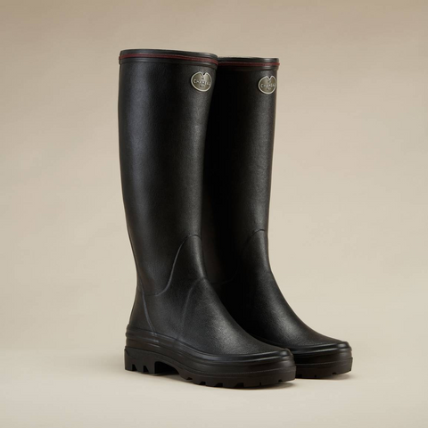 Bottes en caoutchouc naturel pour la marche à la campagne avec doublure en jersey poly-coton ultra-résistante et semelle bi-densité antichoc Le Chameau, offrant confort et adhérence tout terrain, imperméables et fabriquées artisanalement.