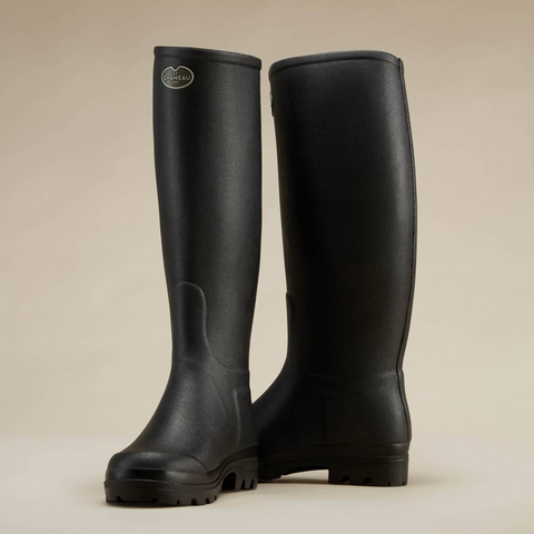 Bottes femmes Le Chameau Saint-Hubert avec doublure en cuir, offrant élégance et imperméabilité pour les activités en plein air, confectionnées artisanalement avec caoutchouc Chamolux et renforts en fibres d’aramide.